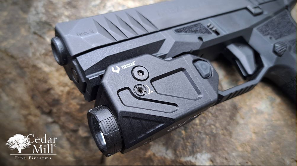 A flashlight is securely mounted on the side of a gun, enhancing visibility in low-light conditions.